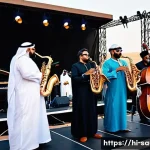 Home 18 사우디아라비아의 재즈 문화와 음악 공연 - **Prompt:** A vibrant and inclusive international jazz festival taking place in a modern outdoor ven...